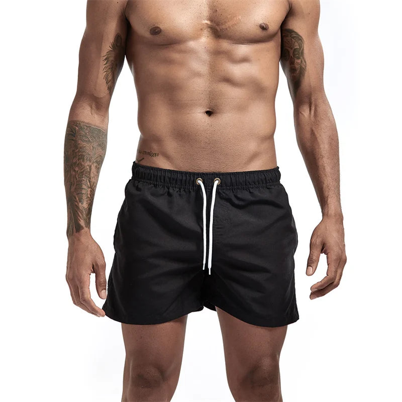 Maillot de bain pour hommes avec doublure en maille poches latérales short de plage solide séchage rapide léger cordon de serrage short de bain maillot de bain d'été