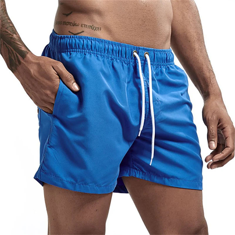Maillot de bain pour hommes avec doublure en maille poches latérales short de plage solide séchage rapide léger cordon de serrage short de bain maillot de bain d'été