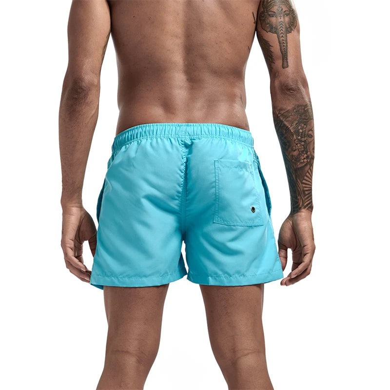 Maillot de bain pour hommes avec doublure en maille poches latérales short de plage solide séchage rapide léger cordon de serrage short de bain maillot de bain d'été