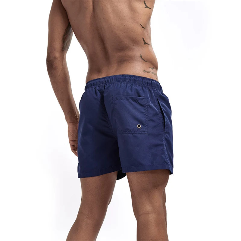 Maillot de bain pour hommes avec doublure en maille poches latérales short de plage solide séchage rapide léger cordon de serrage short de bain maillot de bain d'été