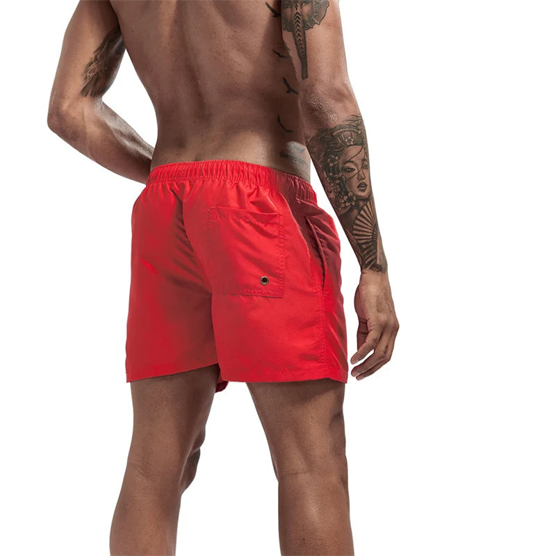 Maillot de bain pour hommes avec doublure en maille poches latérales short de plage solide séchage rapide léger cordon de serrage short de bain maillot de bain d'été