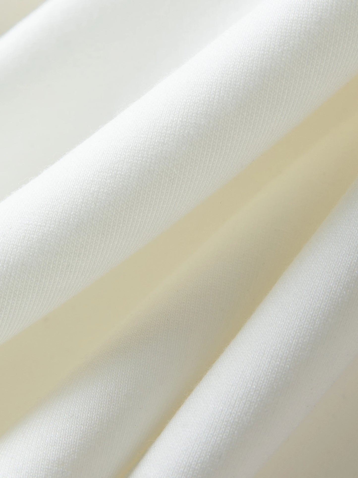 T-shirt femme asymétrique plissé — taille définie, printemps 2026, col en V, manches courtes