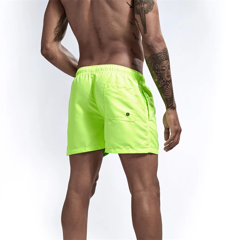 Maillot de bain pour hommes avec doublure en maille poches latérales short de plage solide séchage rapide léger cordon de serrage short de bain maillot de bain d'été
