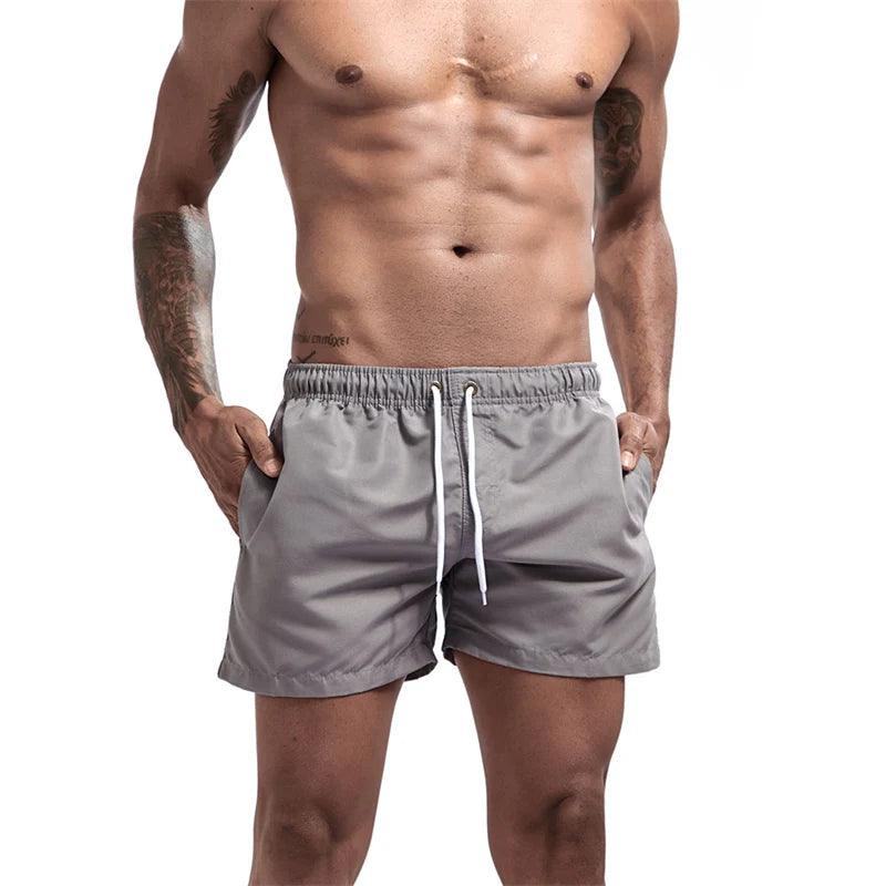 Maillot de bain pour hommes avec doublure en maille poches latérales short de plage solide séchage rapide léger cordon de serrage short de bain maillot de bain d'été